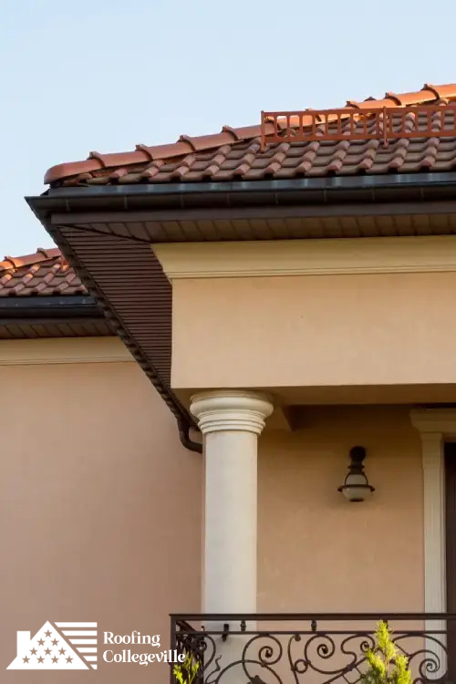 Elegant home with red tile roofing installed by skilled roofing professionals.